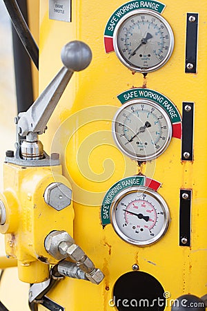 Meters or gauge in crane cabin for measure Maximun load, Engine speed , Hydraulic pressure , Temperature and fuel level Stock Photo