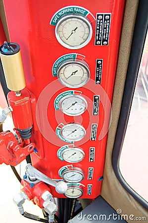 Meters or gauge in crane cabin for measure Maximun load, Engine speed , Hydraulic pressure , Temperature and fuel level Stock Photo