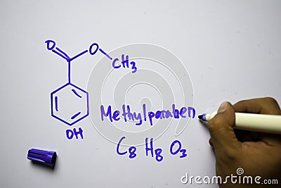 Methylparaben C8,H8,O3 molecule written on the white board. Structural chemical formula. Education concept Stock Photo