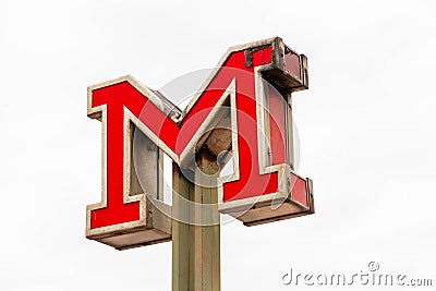 Metro M sign of the Metropolitan subway with facades on the background in Lisbon Portugal Editorial Stock Photo