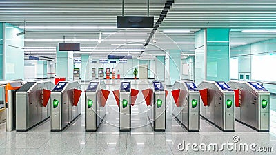 metro station ticket barriers with green light for entry Stock Photo