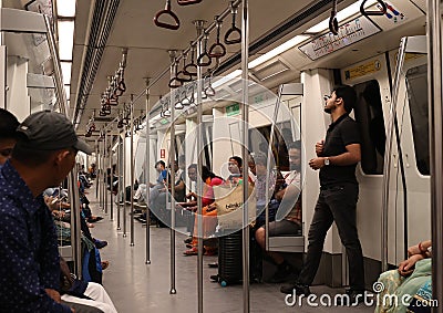 Metro subway underground metro inside train in New Delhi. Editorial Stock Photo