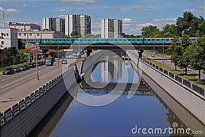 Metro underground train goes by Preobrazhenskiy bridge on Yauza river in Moscow Editorial Stock Photo