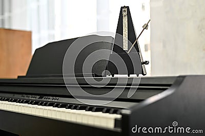 metronome on an electronic piano. selective focusing. musical background. Stock Photo