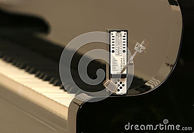 Metronome on a piano Stock Photo