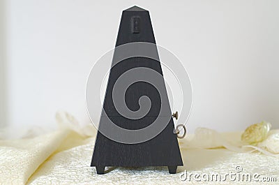 Metronome on the piano Stock Photo