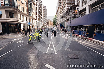 Metropolitan Police Officers on motorbikes waiting for Black Lives Matters crowd protesters to pass Editorial Stock Photo