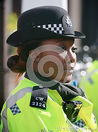 Metropolitan Policewoman on duty in London Editorial Stock Photo