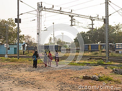 Mettupalayam schoolgirls walking near a train station Editorial Stock Photo