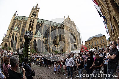 Metz, France July 14, 2024 Procession in the city of the city's emblematic monster, the Graoully, half dragon, half snake. Editorial Stock Photo