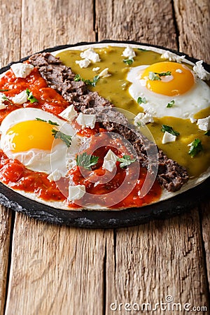 Mexican breakfast: eggs huevos divorciados with beans Frijoles r Stock Photo