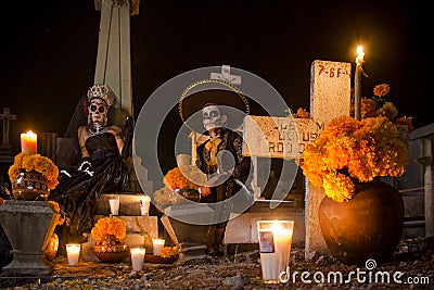 Mexican Catrina and Catrin at a cementery Editorial Stock Photo