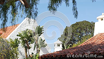 Mexican colonial style suburban, hispanic house exterior, green lush garden, San Diego, California USA. Mediterranean terracotta Stock Photo