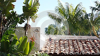 Mexican colonial style suburban, hispanic house exterior, green lush garden, San Diego, California USA. Mediterranean terracotta Stock Photo