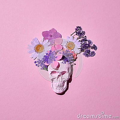 Mexican colorful scull day of dead with flowers on pink background Stock Photo