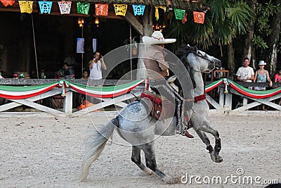 Mexican Cowboy displaying his acrobatic skills Editorial Stock Photo