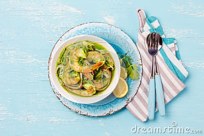 MEXICAN CUISINE. Aguachile de camaron. Prawns aguachile. Shrimps eviche cebiche with cucumber, lemon and purple onion Stock Photo