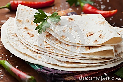 Mexican flatbread tortilla on wooden board Stock Photo