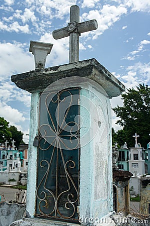 Mexican grave with cross in cemetery Stock Photo
