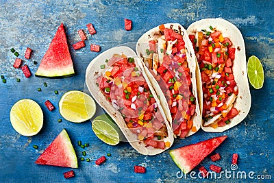 Mexican grilled chicken tacos with watermelon salsa. Stock Photo