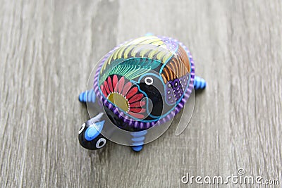 Mexican handcraft turtle over a wood Stock Photo