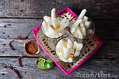 Mexican jicama fruit cutted with lime Stock Photo