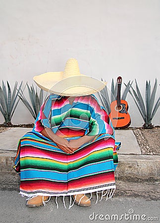 Mexican lazy man sit serape agave guitar Stock Photo