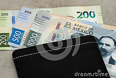 mexican money, 1000,500 and 200 bills, pesos, top denominations, stylish black wallet and currency, business concept, mexico Stock Photo