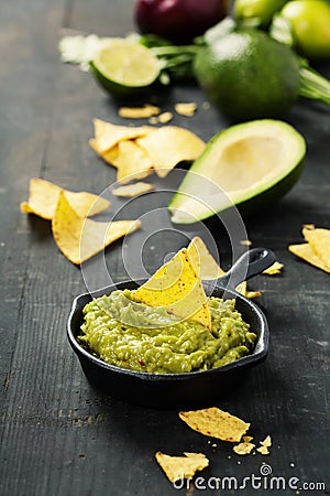 Mexican nachos chips with homemade fresh guacomole sauce Stock Photo