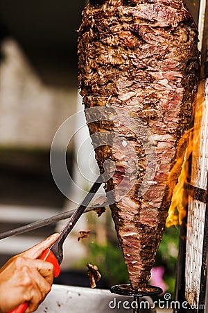 Mexican People eating tacos al pastor in Taqueria in Mexico Stock Photo