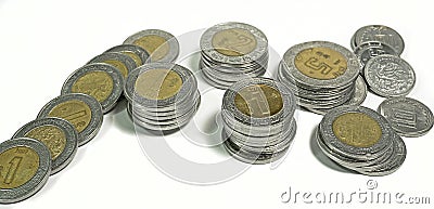 Mexican pesos, stacked coins of various denominations on white background Stock Photo