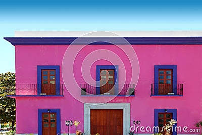 Mexican pink house facade wooden doors Stock Photo