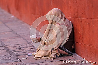 Mexican street beggar woman with head covered Stock Photo