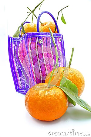Mexican style bag for the errand or to go to the market, with tangerines inside on a white background Stock Photo