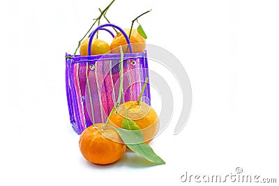 Mexican style bag for the errand or to go to the market, with tangerines inside on a white backgroundMexican style bag for the Stock Photo