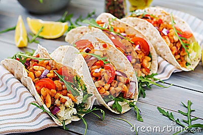 Mexican tacos with beef, beans in tomato sauce Stock Photo