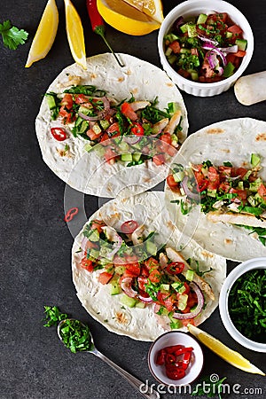 Mexican tacos with filling and guacamole sauce Stock Photo