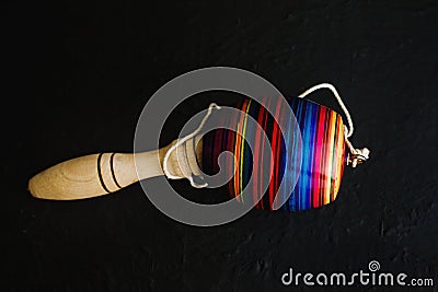 Mexican toys from Wooden, balero, yoyo and trompo in Mexico on black background Stock Photo