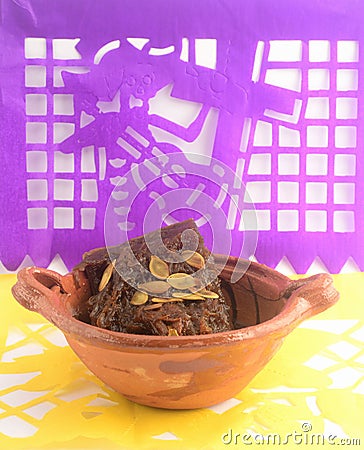 Mexican traditional pumpkin sweet made with piloncillo and cinammon on a clay pot, known as calabaza en tacha with decoration Stock Photo