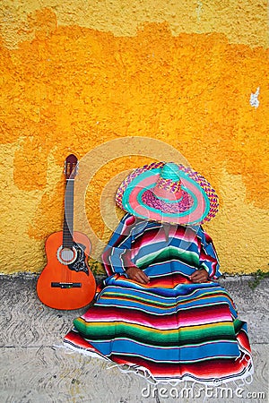 Mexican typical lazy man hat guitar serape Stock Photo