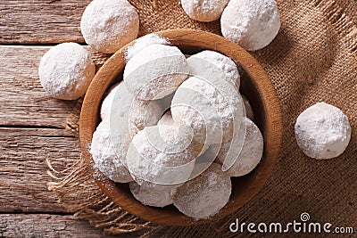 Mexican wedding cookies close up in a wooden bowl. Horizontal to Stock Photo