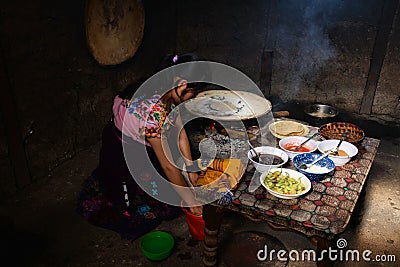 Mexican woman making meal Editorial Stock Photo