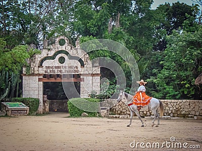 Mexican woman in traditional clothes riding a horse in Yucatan, Mexico Editorial Stock Photo