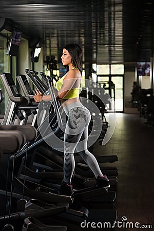 Mexican Women On Elliptical Treadmill In Fitness Gym Stock Photo