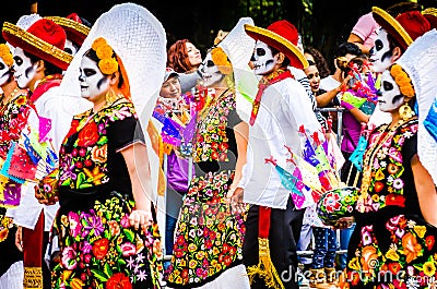 Mexico City, Mexico - October 27, 2018. Celebration of Day of Dead parade, Dia de los Muertos desfile - mask parade Editorial Stock Photo