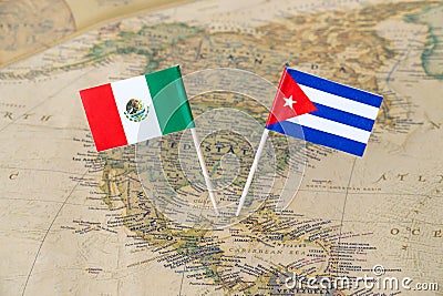 Mexico and Cuba flag pins on a world map, political relations concept Stock Photo