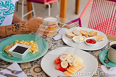 Mexico, holbox - february, 2020 breakfast for tourist in the hotel with eggs, toast and fruit Editorial Stock Photo