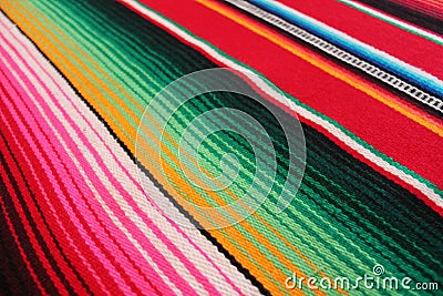 Mexico poncho serape maracas Mexican traditional cinco de mayo rug poncho fiesta background with stripes Stock Photo