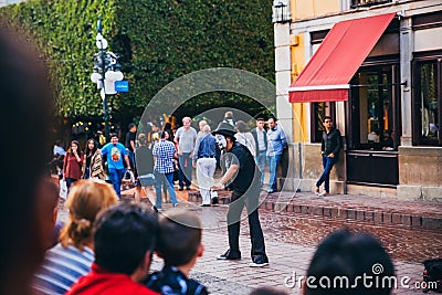 MEXICO - SEPTEMBER 23: Mime doing a street performer for a crow Editorial Stock Photo