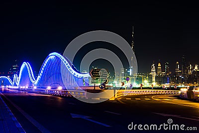 Meydan bridge and Dubai cityscape at night Stock Photo